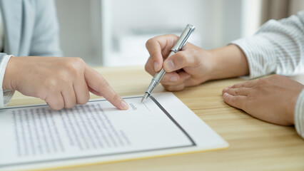 Home loan insurance. .Real estate broker and client  sign contract insurance agreement document. Business meeting concept