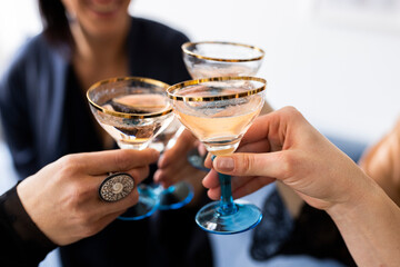 Four women saying cheers with champagne glasses Nr.1