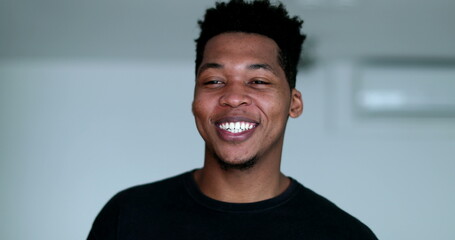 Happy young African American black man laughing and smiling