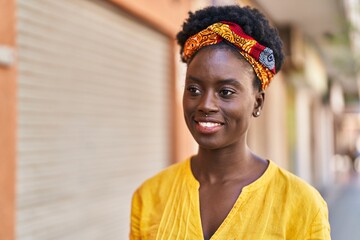 Young african american woman smiling confident standing at street