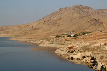 The reflection of the mountains in the Tigris River in the city of Hasankeyf in the Southeast...