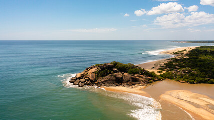 Fototapeta na wymiar Flying over a beautiful sandy beach and a blue ocean. Crocodile Rock, Sri Lanka.