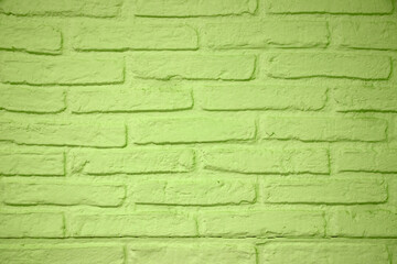 Obraz premium Stone texture background. Closeup of a green brick wall texture. Abstract brick stones pattern background concept, retro layout, interior design and wall banner.