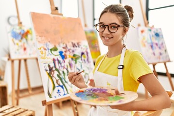 Adorable girl smiling confident drawing at art studio