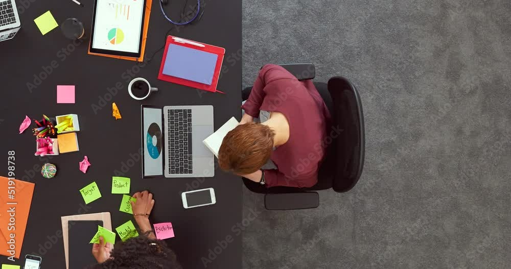 Poster Timelapse of a productive team of employees working together in the office from above. Multitasking colleagues collaborating, networking and developing new ideas for a successful startup company