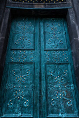 Ancient doors in the cathedral, turquoise old doors.