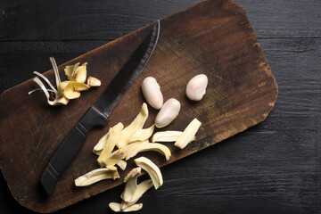 jackfruit flesh pieces and seeds on a cutting board, with a knife, tropical health beneficial fruit native to southeast asia, taken from above with copy space - obrazy, fototapety, plakaty