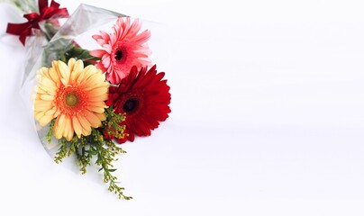 A bright bouquet with gerberas. Background for a greeting card.