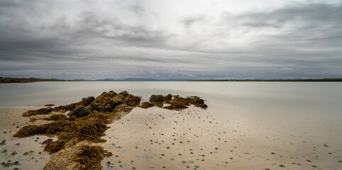 panorama landscape of the beautiful white sand Elly Bay Beach on the Mullet Peninsula of Ireland at low tide