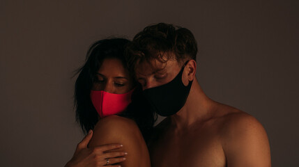 Couple in love. Sensual. Shadow. Love couple. Man and woman posing. Mask face. Guy. 