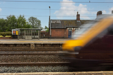 Longport, Stoke on Trent United kingdom June 08 2022  motion blur speeding express train concept travelling through train station