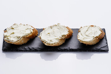 baguette cream cheese sandwich on a white background