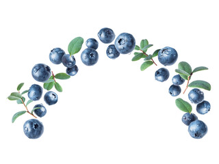 Wet blueberries in the air with leaves closeup isolated on a white background