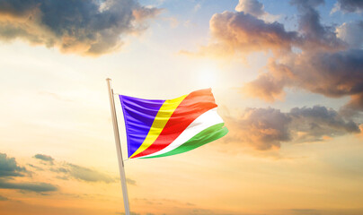 Seychelles national flag cloth fabric waving on the sky - Image