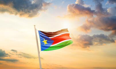 Sudan national flag cloth fabric waving on the sky - Image