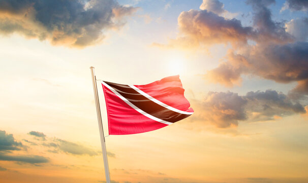 Trinidad and Tobago national flag cloth fabric waving on the sky - Image