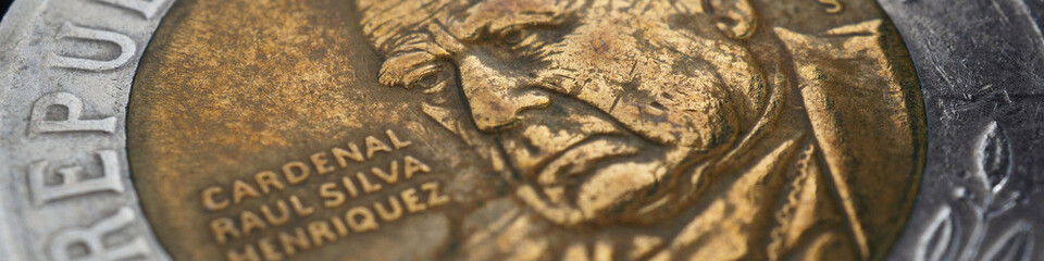 Translation: Republic of Chile. Coin of 500 Chilean pesos close-up. Peso of Chile. News about...