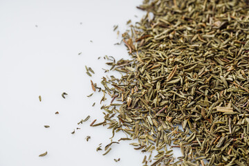 fragrant dried thyme on a white acrylic background