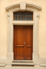Fototapeta na wymiar View of building with wooden door. Exterior design
