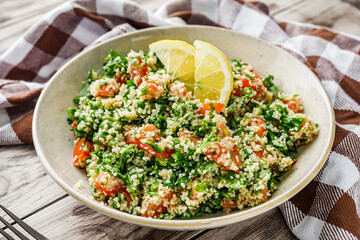 arabic salad tabbouleh on a rustic wooden background