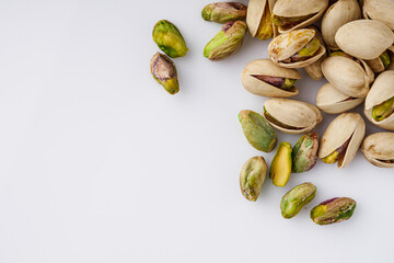 fresh salted pistachios on a white background