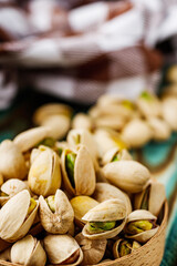 fresh salted pistachios on a wooden rustic background