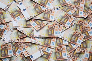 Fototapeta na wymiar 50 Euro banknotes as background, top view. Money exchange
