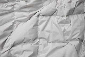 Soft crumpled blanket as background, top view