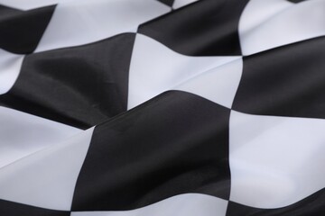 Checkered finish flag as background, closeup view