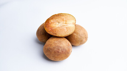 Sapodilla and fresh fruit isolated on a white background