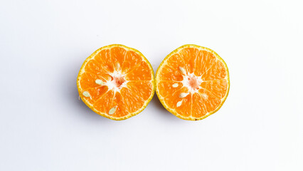 Fototapeta premium Close-up of freshly cut orange fruit isolated on white background
