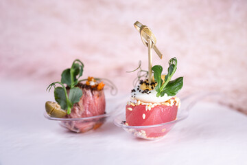 bruschetta a piece of stewed beef on a plastic spoon