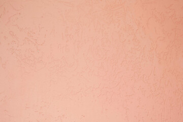 Cement plaster on the wall of a building. Pink color