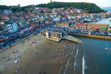 Fototapeta na wymiar aerial view of South Bay Beach and Harbour Scarborough, North Yorkshire England