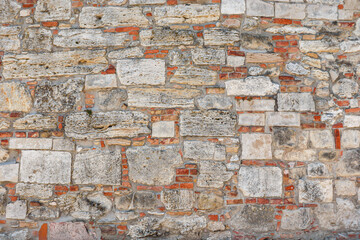Old picturesque masonry wall as a background.