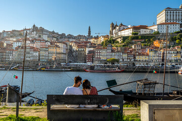 City of Oporto, Portugal in the margins of the Douro river. Douro river in the city of Oporto with...