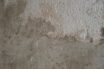 Plaster coating on white bumpy wall