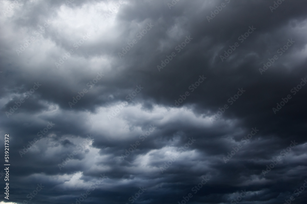 Poster the dark sky with heavy clouds converging and a violent storm before the rain.bad or moody weather s