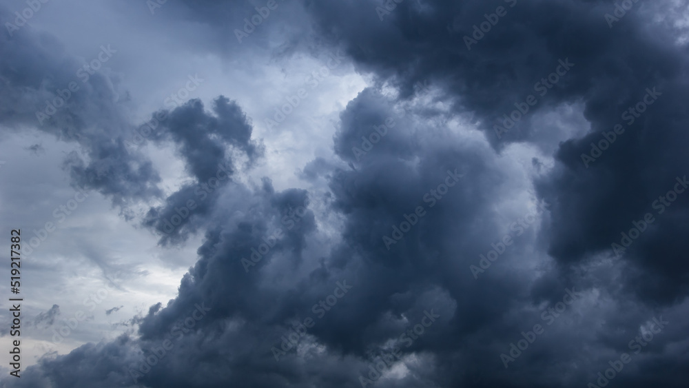Poster the dark sky with heavy clouds converging and a violent storm before the rain.bad or moody weather s