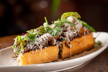 Hen of the Woods Mushroom Toast topped with Greens.