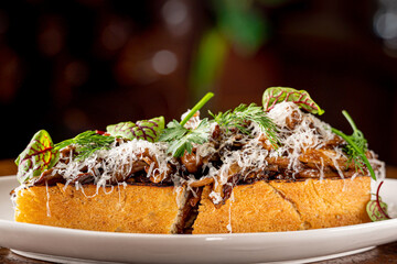 Hen of the Woods Mushroom Toast topped with Greens.