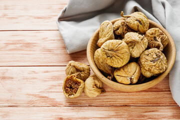 delicious dried figs on a wooden rustic background