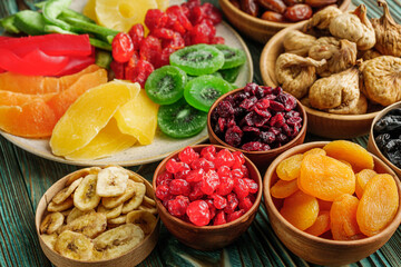 set of various dried fruits on a wooden rustic background