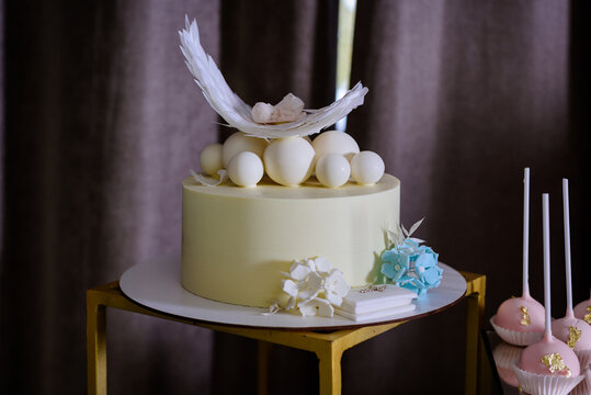 Christening cake for baby,  cake with wings. Christening party candy bar