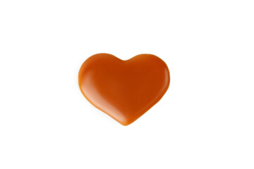 Caramel drop of sweet caramel sauce in heart form isolated on white background. Melted heart of liquid toffee.
