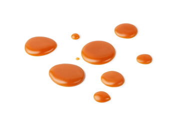 Caramel drops of sweet caramel sauce isolated on white background. Melted liquid toffee. Top view.