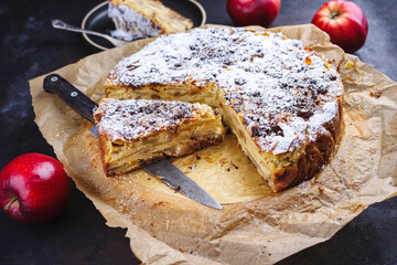 Traditional Sicilian apple pie torta di mele cremosa with icing sugar served as close-up on a...