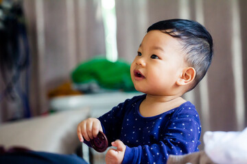boys with buttons to enhance development Learning to use hand skills, fingers and big buttons in many colors.