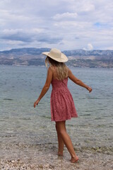 Girl with hat on the beach