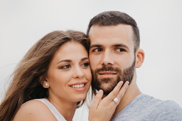 Fototapeta premium A man and his girlfriend are cuddling up to each other on a rocky hill in Spain